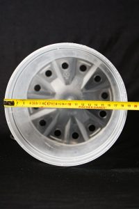 Clear plastic XL plant pot in 19cm size showing drainage holes.