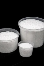 Various tubs of Magnesium Sulphate with crystalline texture visible inside.