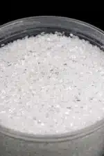 Magnesium Sulphate (Epsom Salt) granules in a clear bowl.