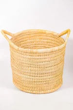 Heavy-duty large palm basket with handles showing detailed craftsmanship and round shape.