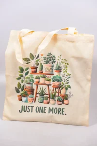 Front view of plant-themed tote bag laid flat.