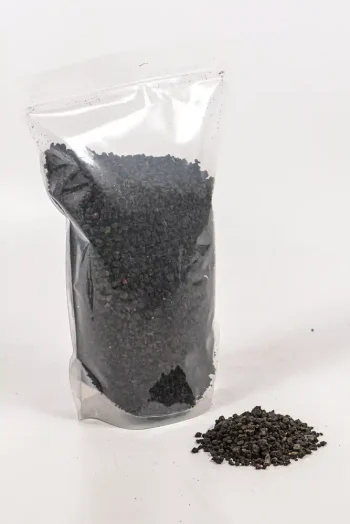 Lava stones used as a drainage layer in plant pots.