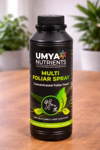Black bottle of Umya Multi Foliar Spray on a wooden table